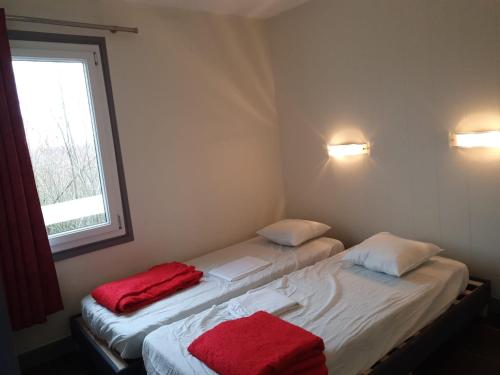 Giường trong phòng chung tại hotel barbery