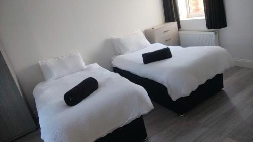 Ένα ή περισσότερα κρεβάτια σε δωμάτιο στο The Stadium Rooms Elegant and Comfy Stay