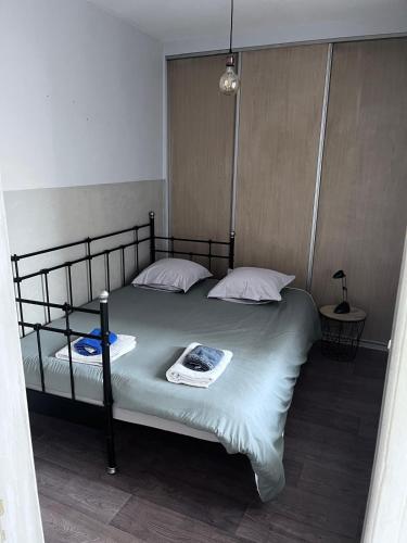 Ένα ή περισσότερα κρεβάτια σε δωμάτιο στο "Côté nature", appartement cosy au cœur de Munster