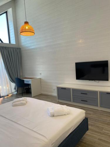 Ένα ή περισσότερα κρεβάτια σε δωμάτιο στο Aykan Resort by Aquasia