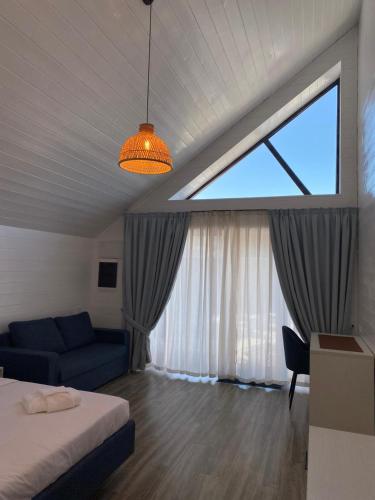 Ένα ή περισσότερα κρεβάτια σε δωμάτιο στο Aykan Resort by Aquasia