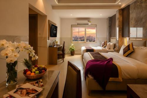 a bedroom with a large bed and a living room at Dahabi Airport Hotel Era in New Delhi