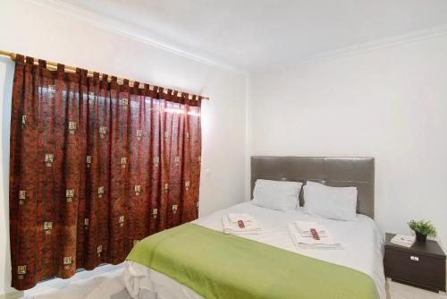 Ένα ή περισσότερα κρεβάτια σε δωμάτιο στο Algarve Paraíso - Monte da Balaia