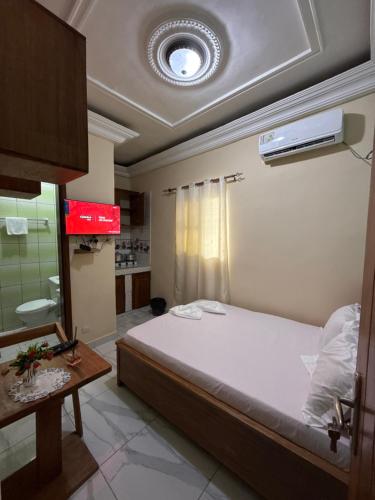 Una cama o camas en una habitación de Résidence akiba home plus