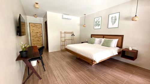 Postel nebo postele na pokoji v ubytování Aulea Siargao