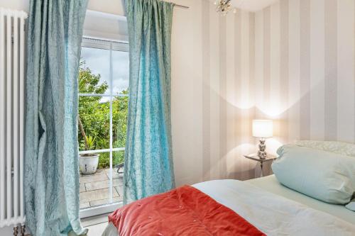 En eller flere senge i et værelse på Ferienhaus Christina