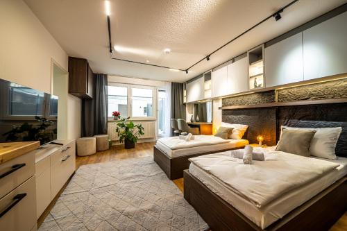 Postel nebo postele na pokoji v ubytování City-House-Achern Studios