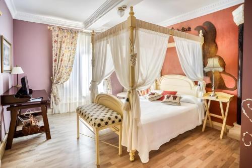 Postel nebo postele na pokoji v ubytování Posada del Indiano