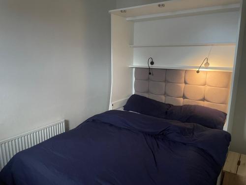 En eller flere senge i et værelse på Central Dublin 2-Bed House Sleeps 4 WiFi