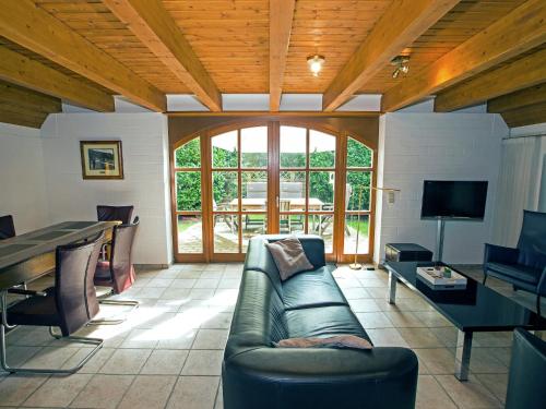 TV a/nebo společenská místnost v ubytování Ferienhaus Boschhuys