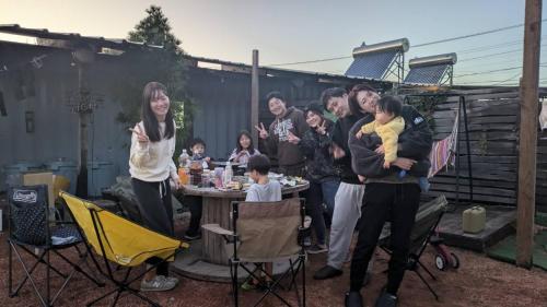a group of people standing around a table at Asahi Seaside Cottage - Vacation STAY 42134v in Asahi