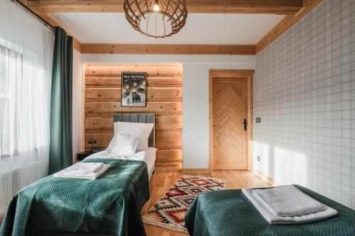 Postel nebo postele na pokoji v ubytování Apartament u Młynarki