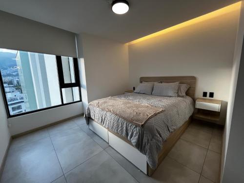 Postel nebo postele na pokoji v ubytování Suite ejecutiva - Trabajo y Descanso - Exclusividad y Lujo - Sector La Carolina, Quito