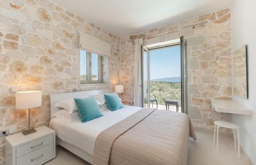 Postel nebo postele na pokoji v ubytování Villa Taphian