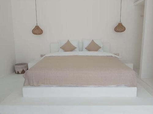 En eller flere senge i et værelse på Dakings Greece House