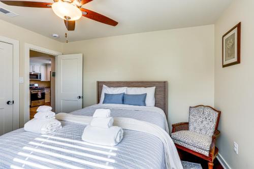 a bedroom with a bed with towels on it at 8 Mi to Dtwn New Orleans! Newly Renovated Home in Metairie