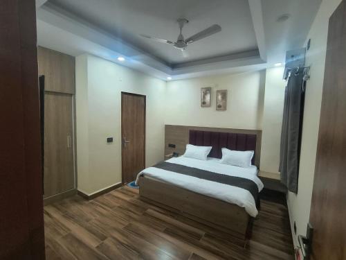 a bedroom with a large bed in a room at Expo Residency Inn in Jāmb