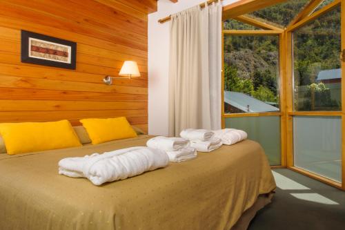 Postel nebo postele na pokoji v ubytování Del Sauco Apart & Spa