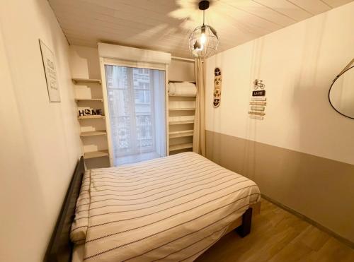 En eller flere senge i et værelse på L'Escapade Pannessac troisième étage