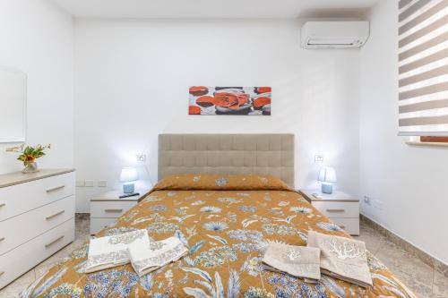 Кровать или кровати в номере Casa Carolina Pozzallo
