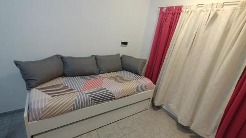 En eller flere senge i et værelse på Dptos Reynoso