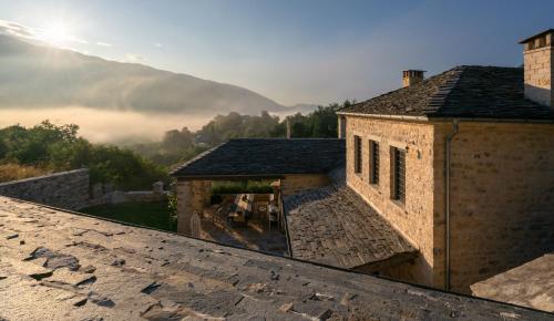 a view from the roof of a building with mountains in the background at Apeiros Chora Hotel in Kato Pedina