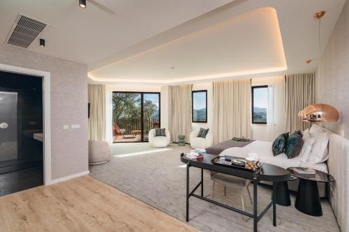 a living room with a couch and a table at Haven Nature Hotel & Villas in Batalha
