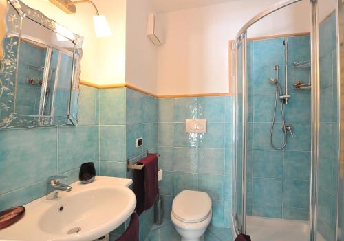 a bathroom with a sink and a toilet and a shower at Fruit Flats by AMALFIVACATION in Minori