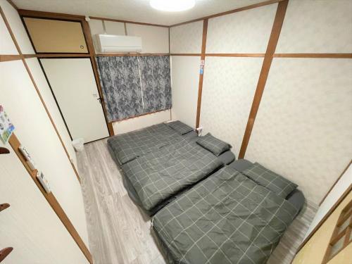 Postel nebo postele na pokoji v ubytování Hirakata - House - Vacation STAY 20200