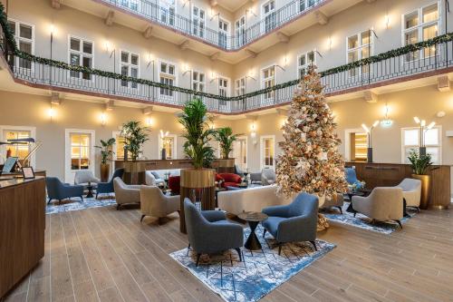 a christmas tree in the lobby of a hotel at BasiliQ Hotel in Budapest