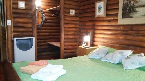 En eller flere senge i et værelse på Dielmeral Cabañas