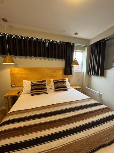 Ένα ή περισσότερα κρεβάτια σε δωμάτιο στο CASA CRISTOBAL Centenario