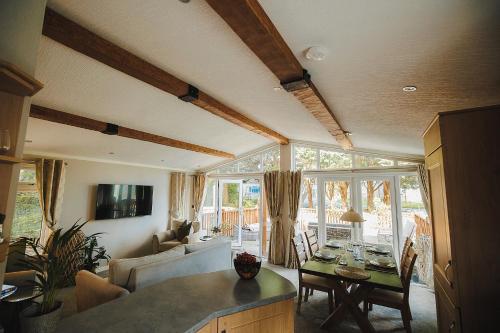 a living room with a couch and a table at Caer Rhun Hall Hotel in Conwy