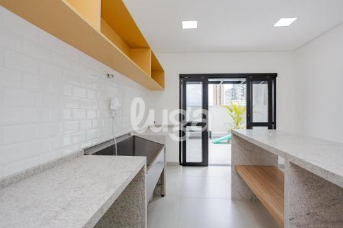a room with white walls and marble countertops at Studio Resort Heated Pool GYM Best Location in Curitiba