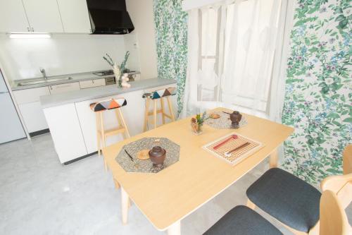 a kitchen with a table and chairs in a room at Ikebukuro# Nakaitabashi 3DK room# 5 minutes walk from station in Tokyo