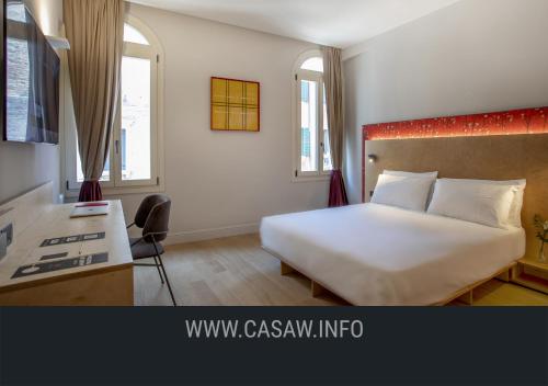 Ένα ή περισσότερα κρεβάτια σε δωμάτιο στο Hotel Casa W