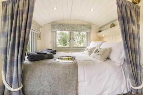 a bedroom with a large white bed with a window at 1 Bed in Leintwardine oc-b29785 in Brampton Bryan
