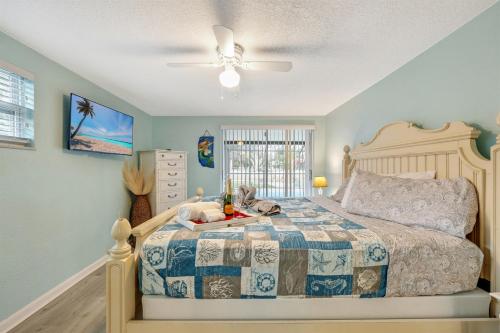 a bedroom with a bed with a stuffed animal on it at Cozy Oasis Screened Pool Picturesque Water Canal Views! in Port Richey