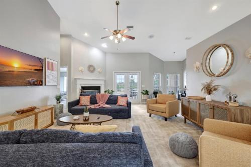 a living room with a couch and a table at Pool Waterfront Lake 12 PPL Gorgeous in Riverview