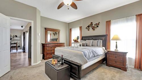 a bedroom with a bed and a ceiling fan at Valrico's Hidden Gem A Stunning 3-Bedroom Oasis Awaits! in Valrico