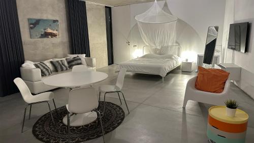 En eller flere senge i et værelse på Villa Pescaria