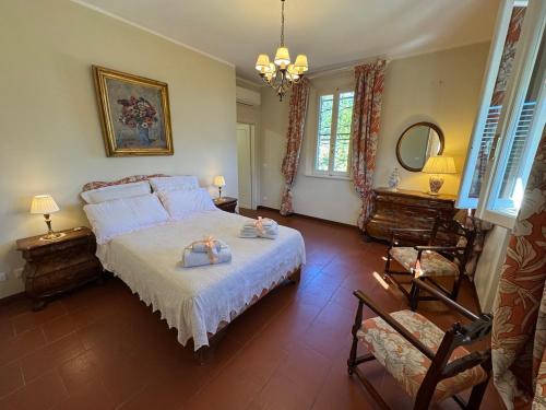 En eller flere senge i et værelse på Casa Mia