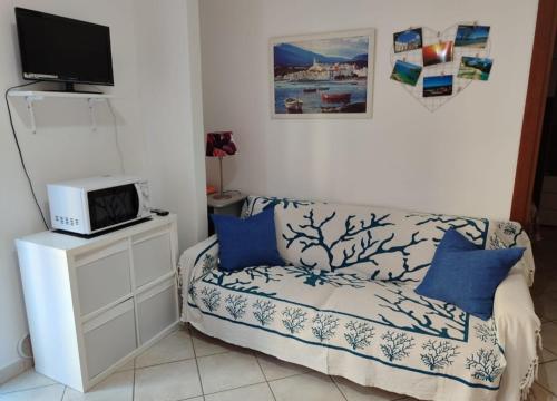 En eller flere senge i et værelse på Casa Marina