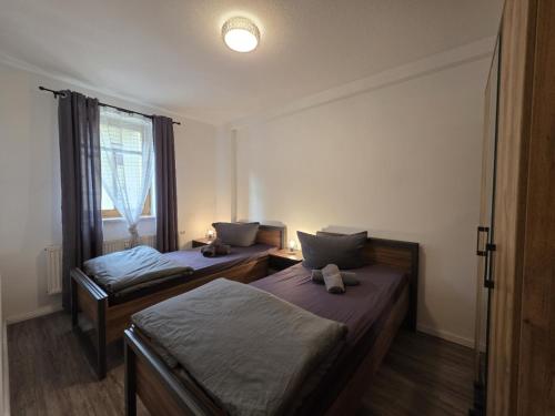 Postel nebo postele na pokoji v ubytování Mikra Homes24 in Glauchau