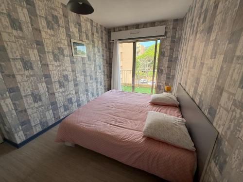 En eller flere senge i et værelse på Chambre avec balcon vue mer