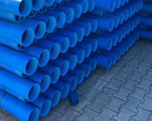 a stack of blue pipes on a brick floor at Villa hemciu in Cluj-Napoca