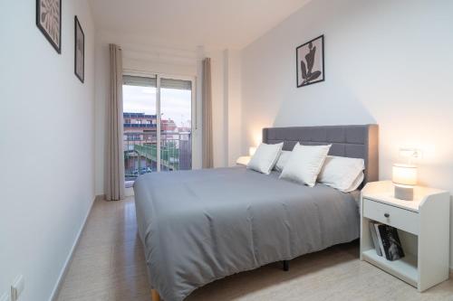 En eller flere senge i et værelse på Cómodo apartamento vacacional en Murcia, El Palmar