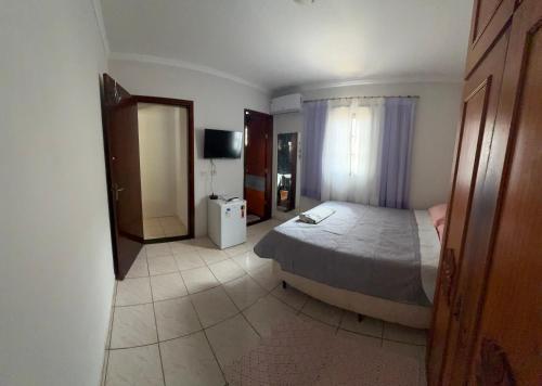 Postel nebo postele na pokoji v ubytování Suítes Santa Luzia