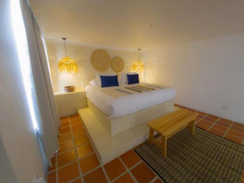 Ένα ή περισσότερα κρεβάτια σε δωμάτιο στο Bohemia Hotel Boutique