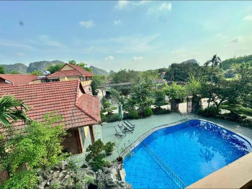 an overhead view of a swimming pool in front of a house at Trang An ViewPoint Homestay in Ninh Binh